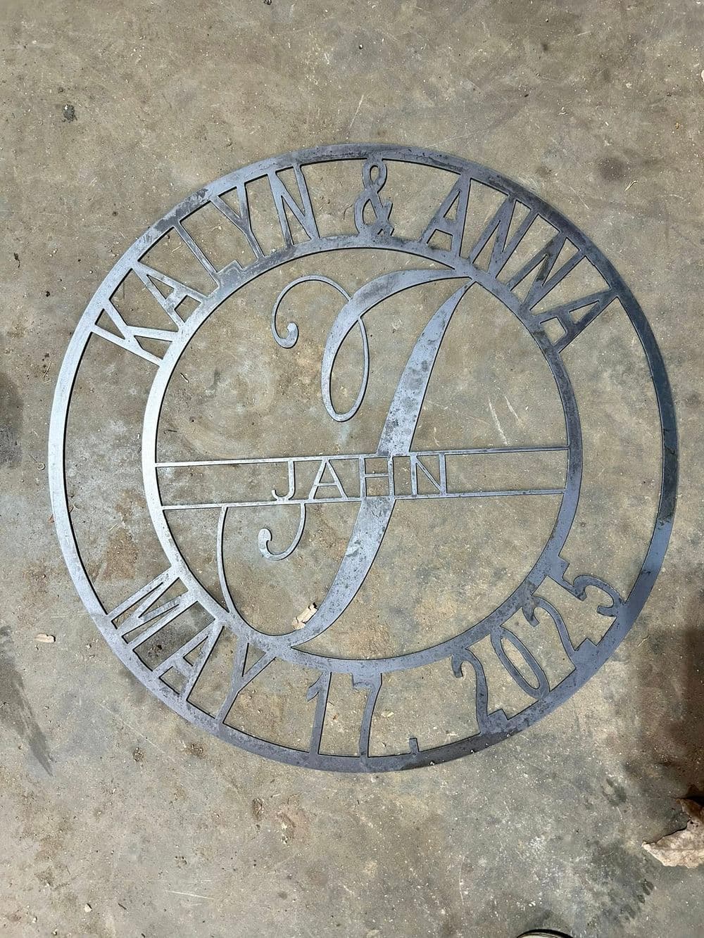 Custom metal sign featuring names Kaylyn and Anna, date May 11, 2015, elegant design.