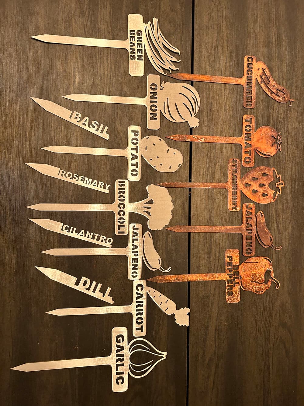 Garden plant markers for vegetables and herbs with names displayed in clear typography.